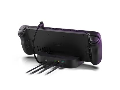 Nyko Power Dock for Steam Deck. A picture of the steam deck sitting on a USB-C breakout dock  with a cable running from teh dock to the Steam Deck and various device cables plugged into the Power Dock hub.